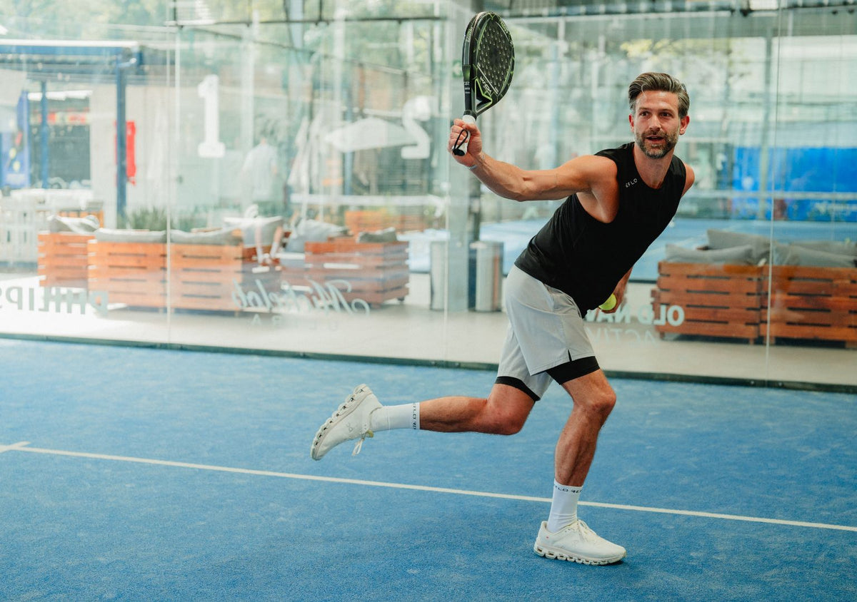 A man playing Padel wearing a Reflo vest