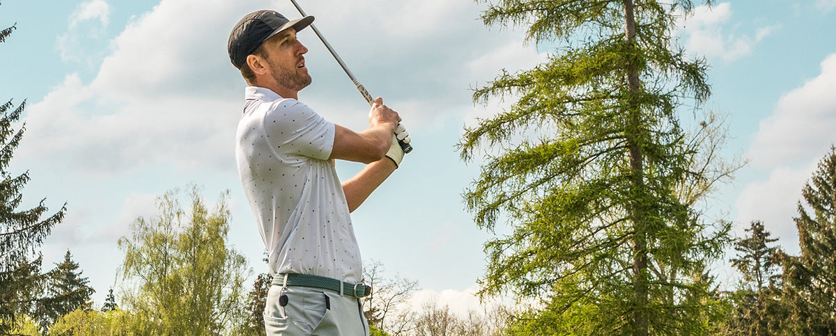 Harry Kane plaing golf while wearing his favourite Reflo clothing