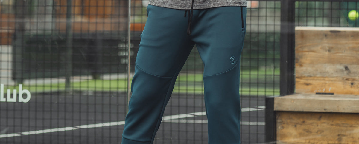 A man wearing Reflo joggers while playing Padel