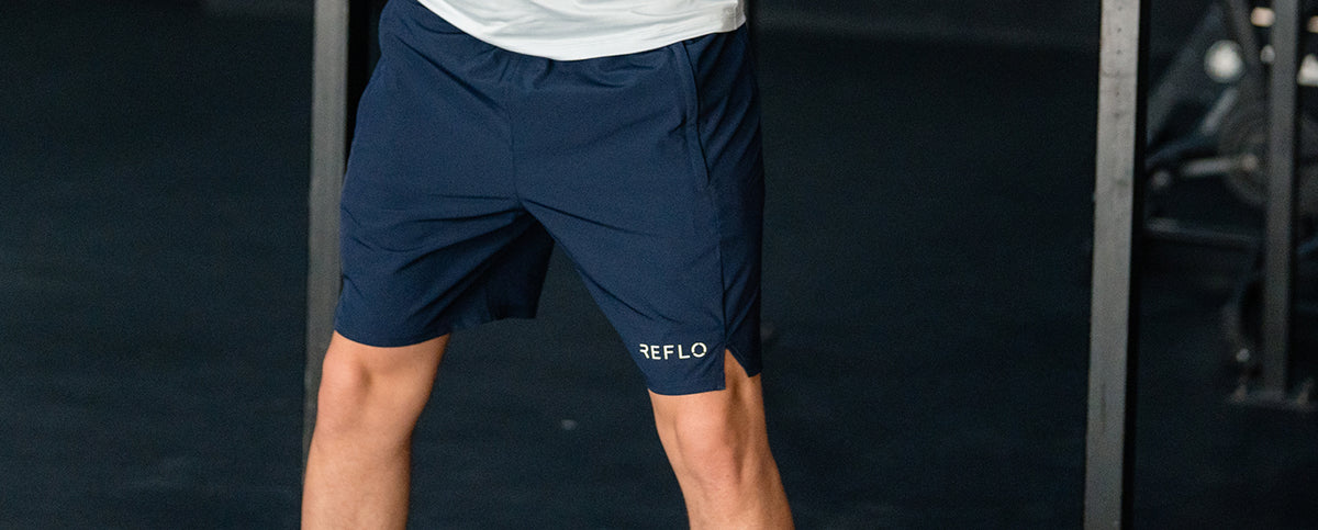 A man wearing Reflo shorts during his gym workout