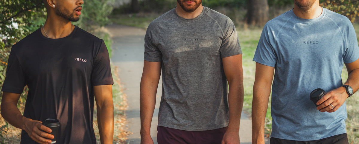 Three men wearing Reflo t-shirts while going for a walk